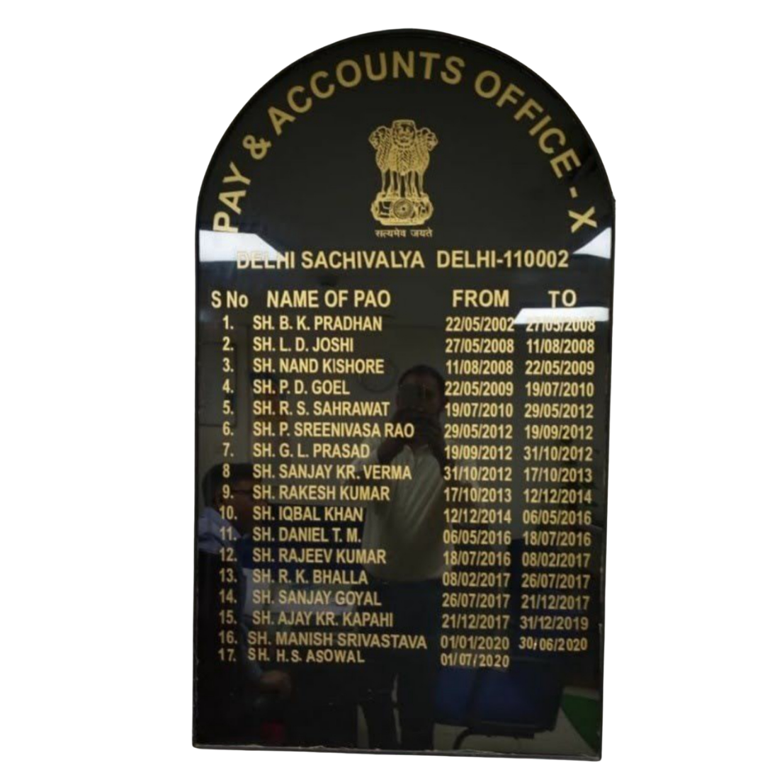 Black plaque listing the names and tenure dates of Pay and Accounts Officers at Delhi Sachivalaya