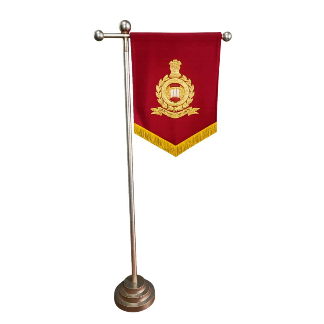 Red fabric table banner with gold embroidered emblem on a silver display stand