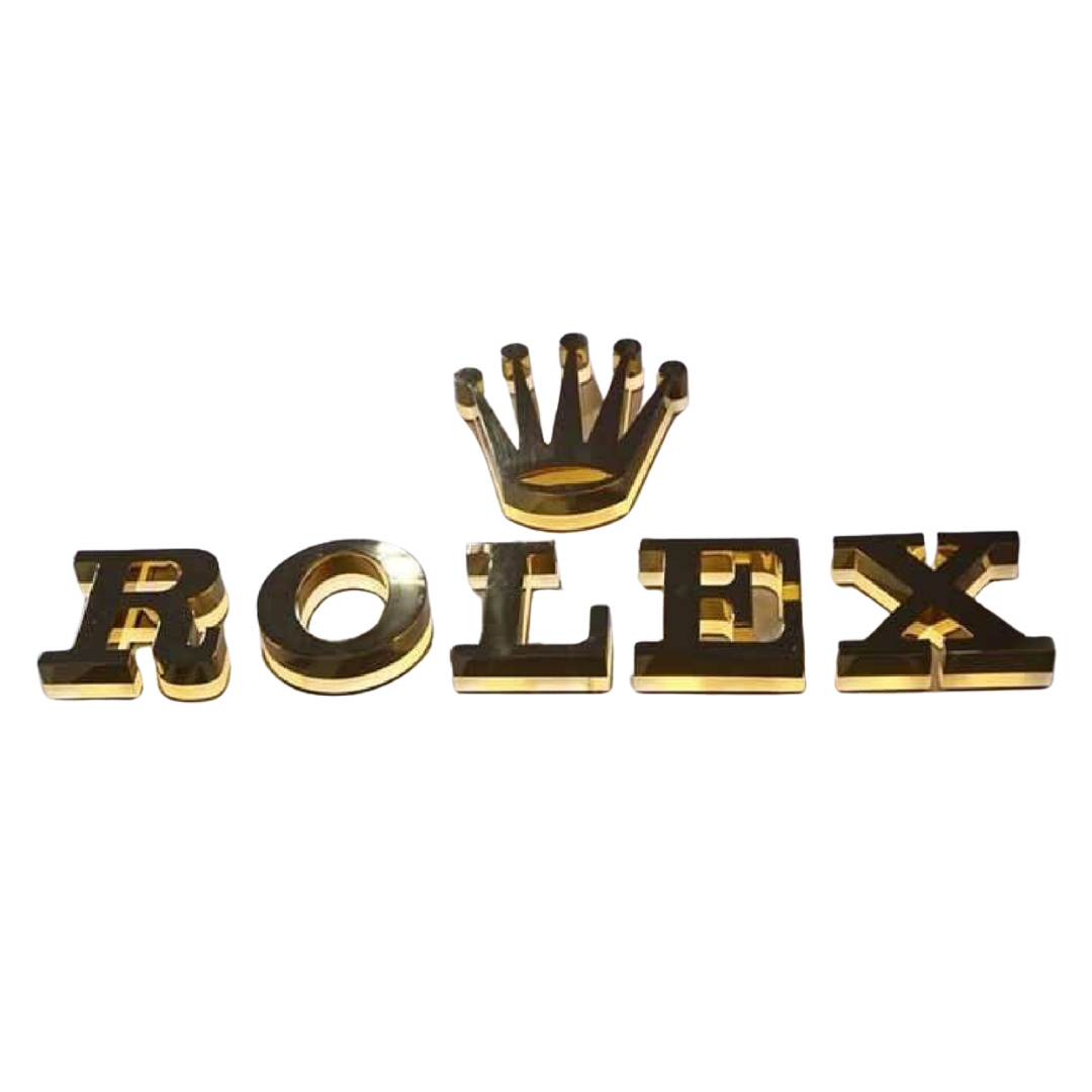 Three-dimensional metallic gold and black letters spelling “ROLEX” with a raised crown symbol above the center.