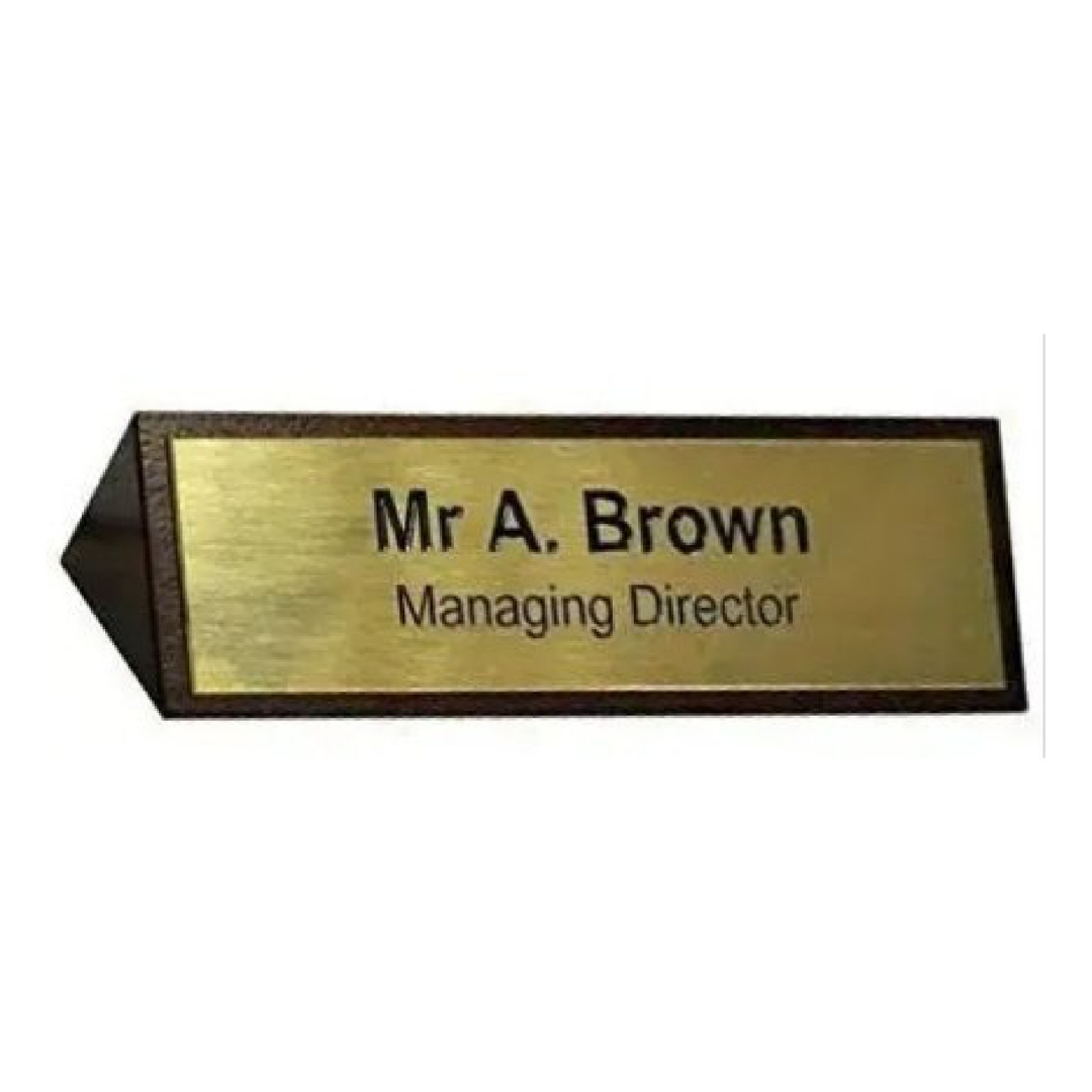 Gold finish tabletop name plate displaying Mr. A. Brown and Managing Director designation