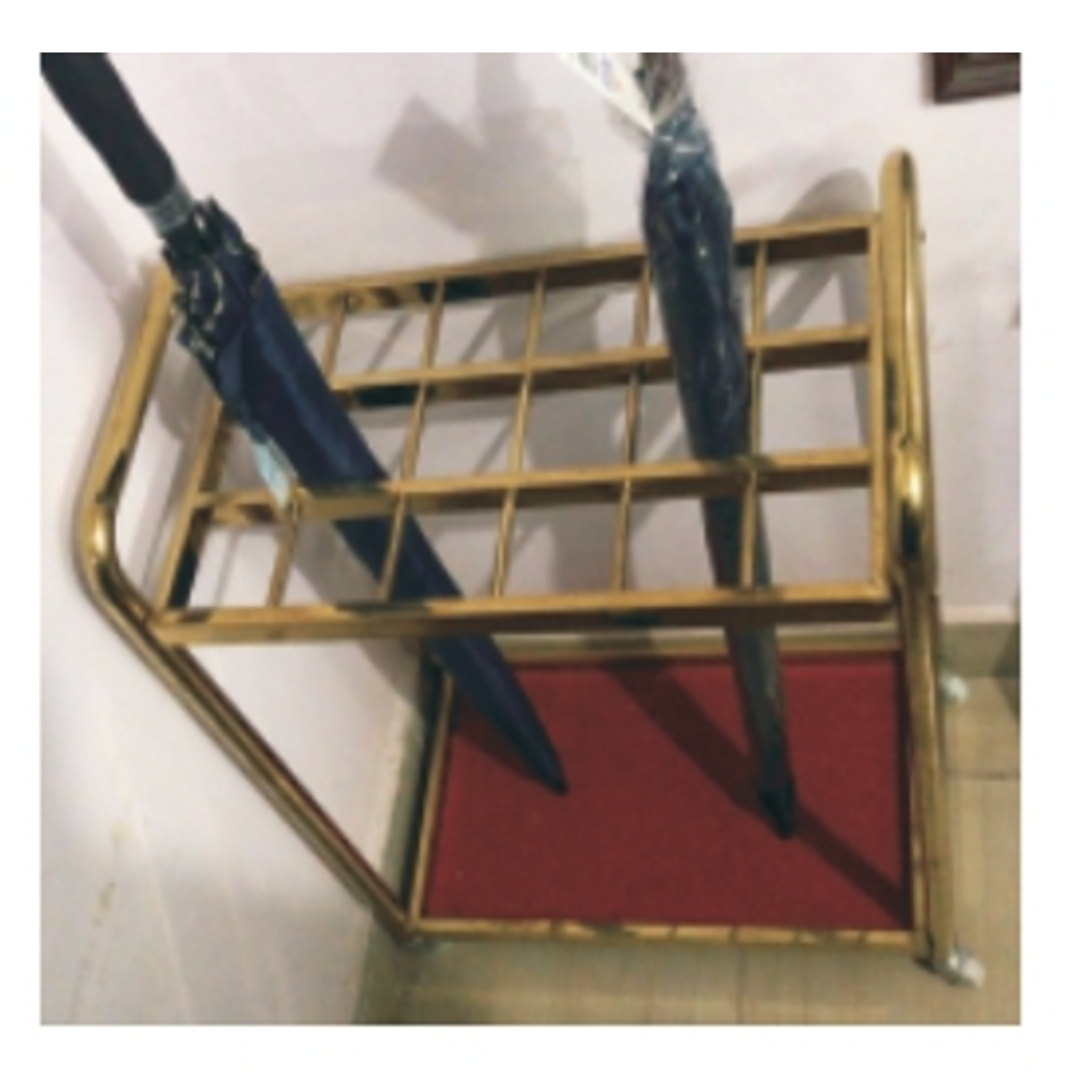Gold metal umbrella stand with red base holding two umbrellas