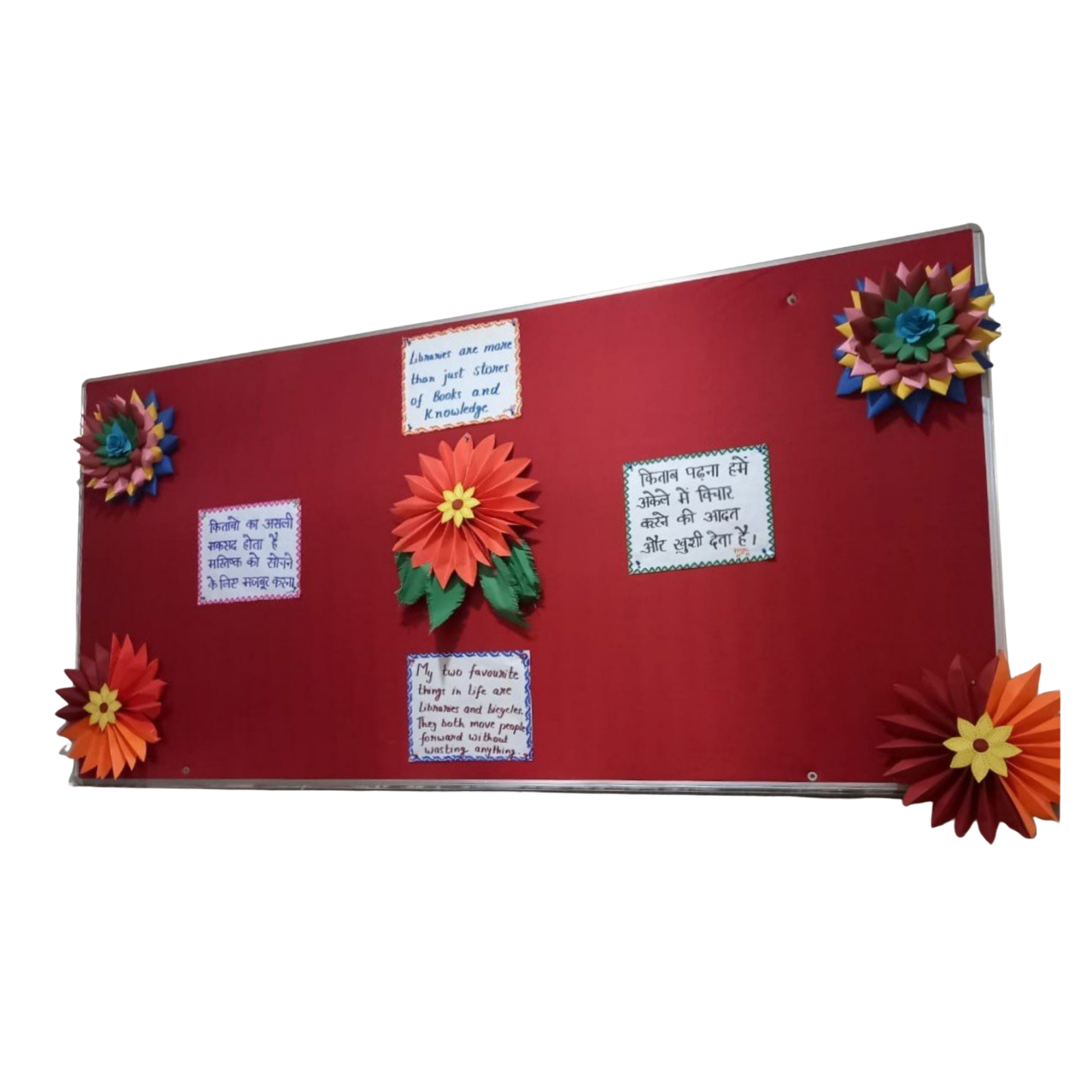 Premium wall mounted red fabric notice board with an anodized aluminium frame displaying pinned educational messages and decorative paper flowers for schools, offices, libraries, and institutions.