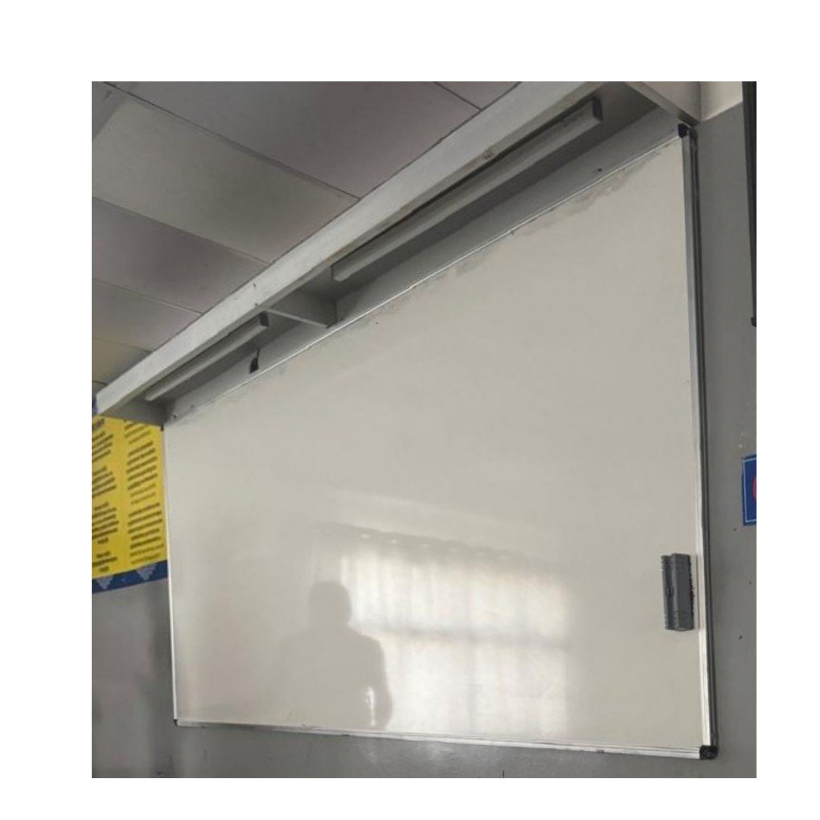 Large wall mounted whiteboard with aluminium frame installed in a classroom by Elite Writing & Display