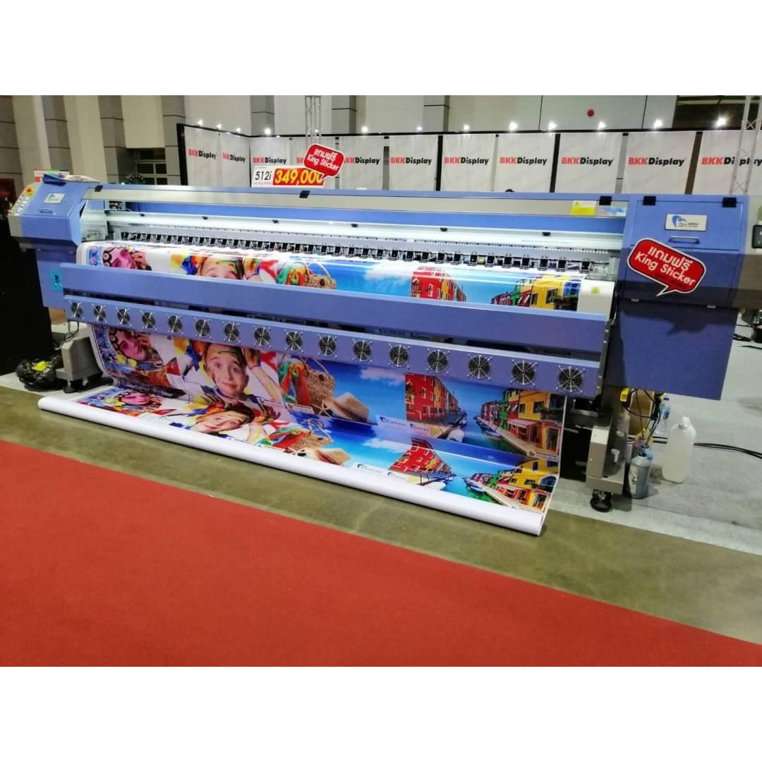 Large format digital printer producing colorful printed banners at a printing exhibition