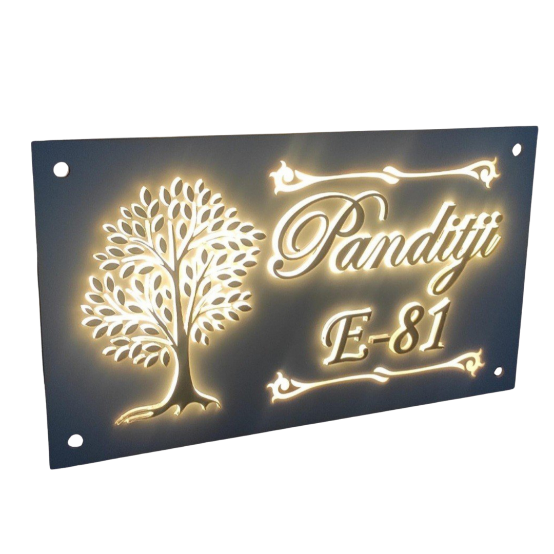 Dark rectangular illuminated wall name plate featuring a glowing tree of life, the name “Panditji,” and house number E-81
