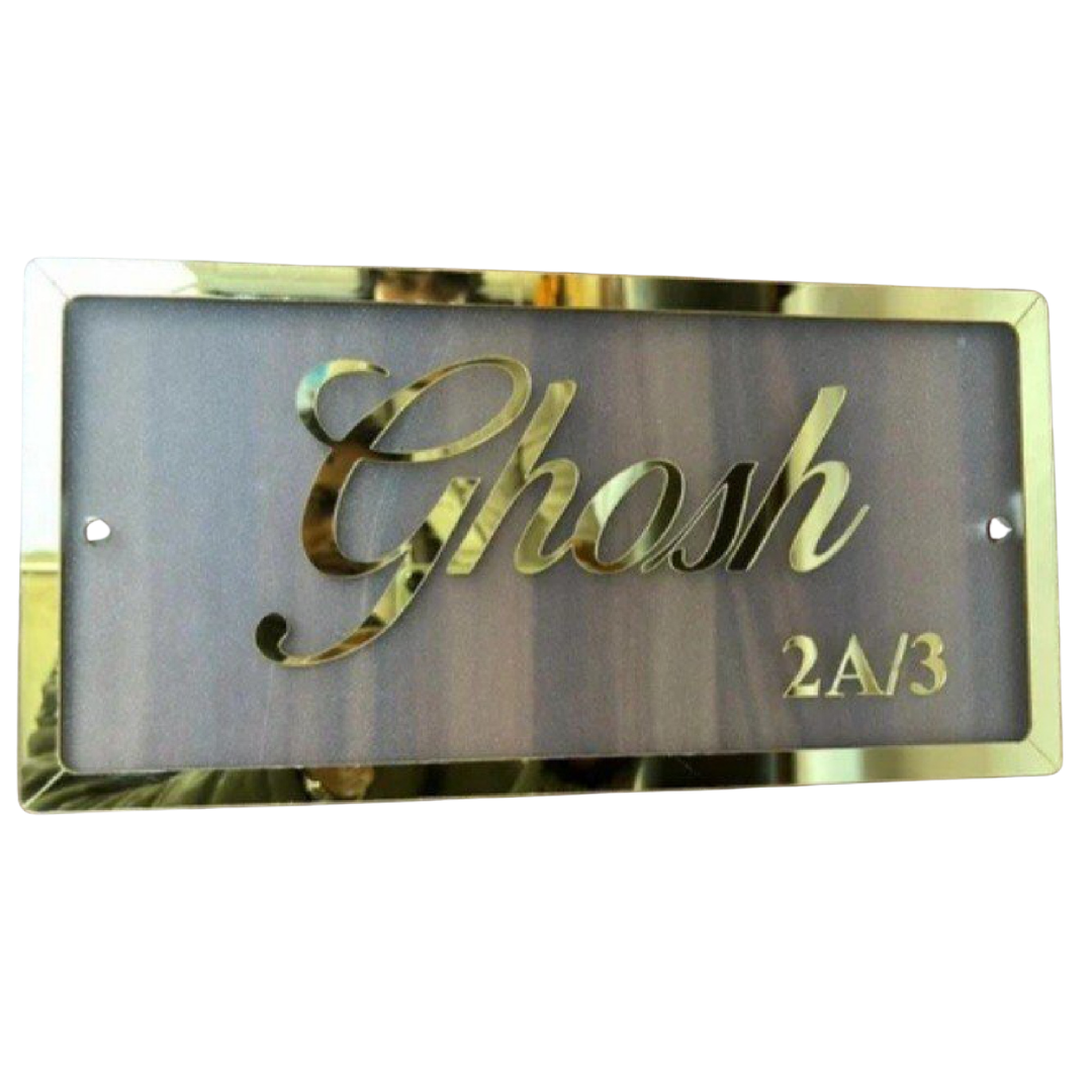 A rectangular black-and-gold name plate displaying the name “Josh” and room number “2A/3”