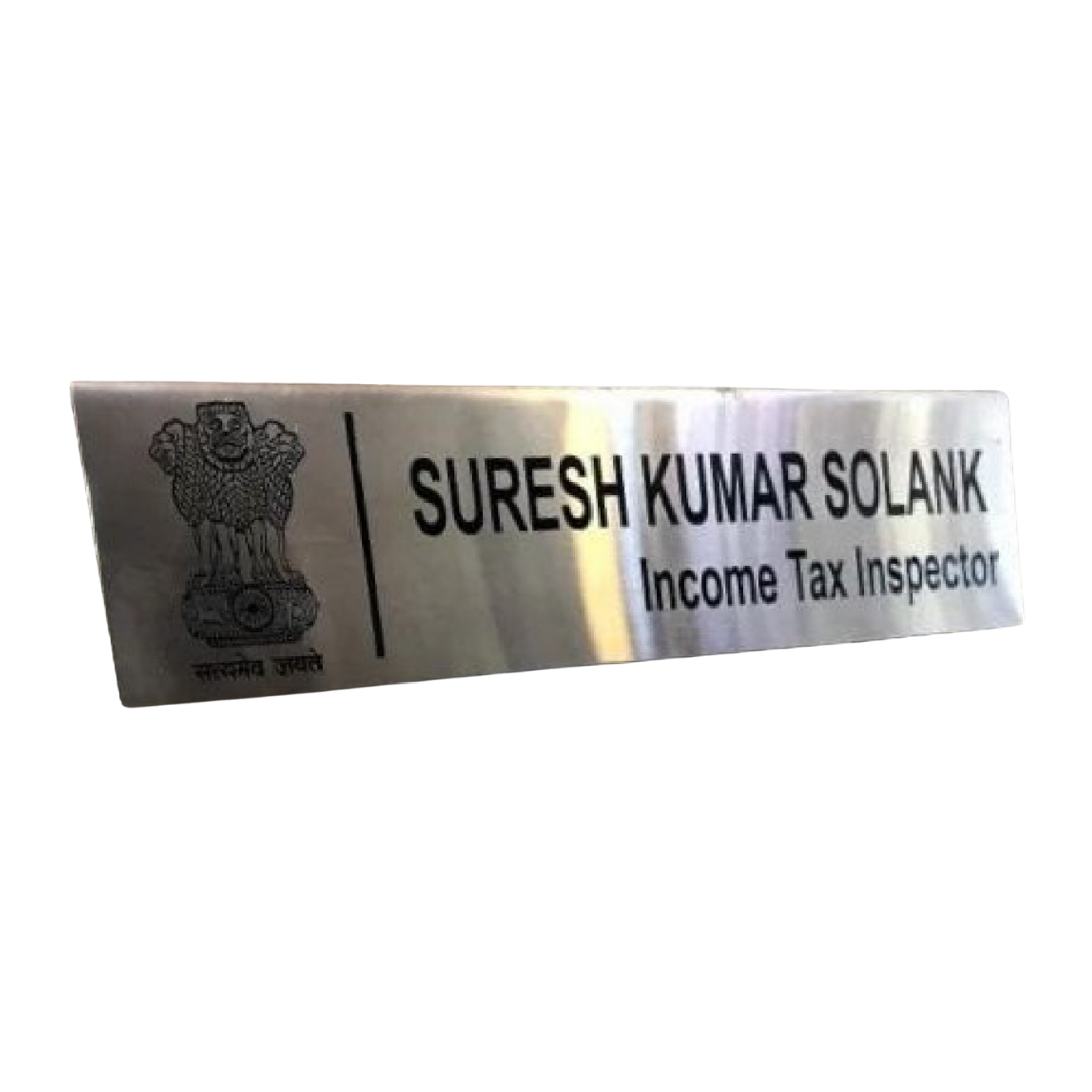 Metallic name plate featuring the Indian national emblem, the name “SURESH KUMAR SOLANKI,” and the designation “Income Tax Inspector.”
