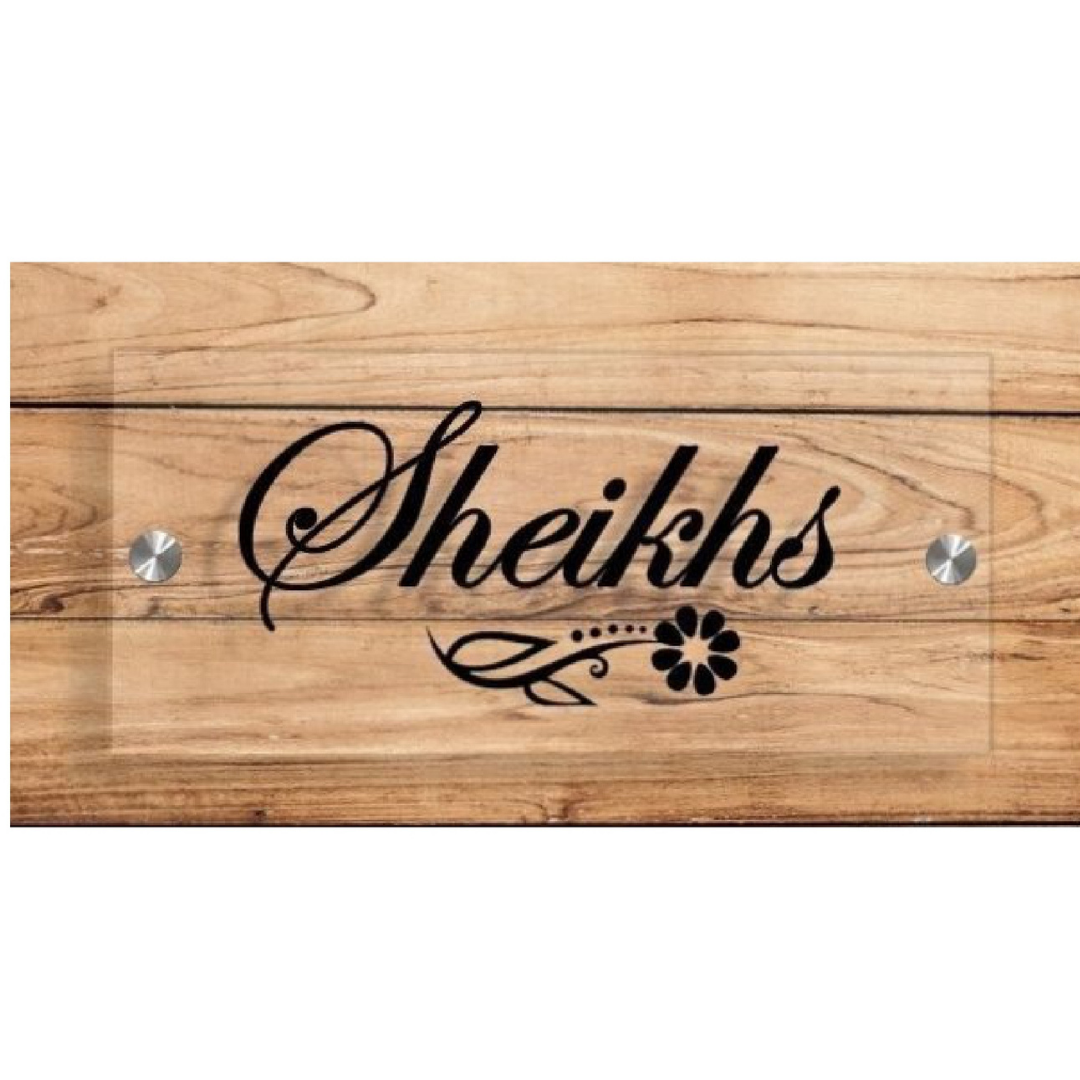 Black rectangular name plate with white lettering reading “Tomer’s” and “Deepak & Meenu.”