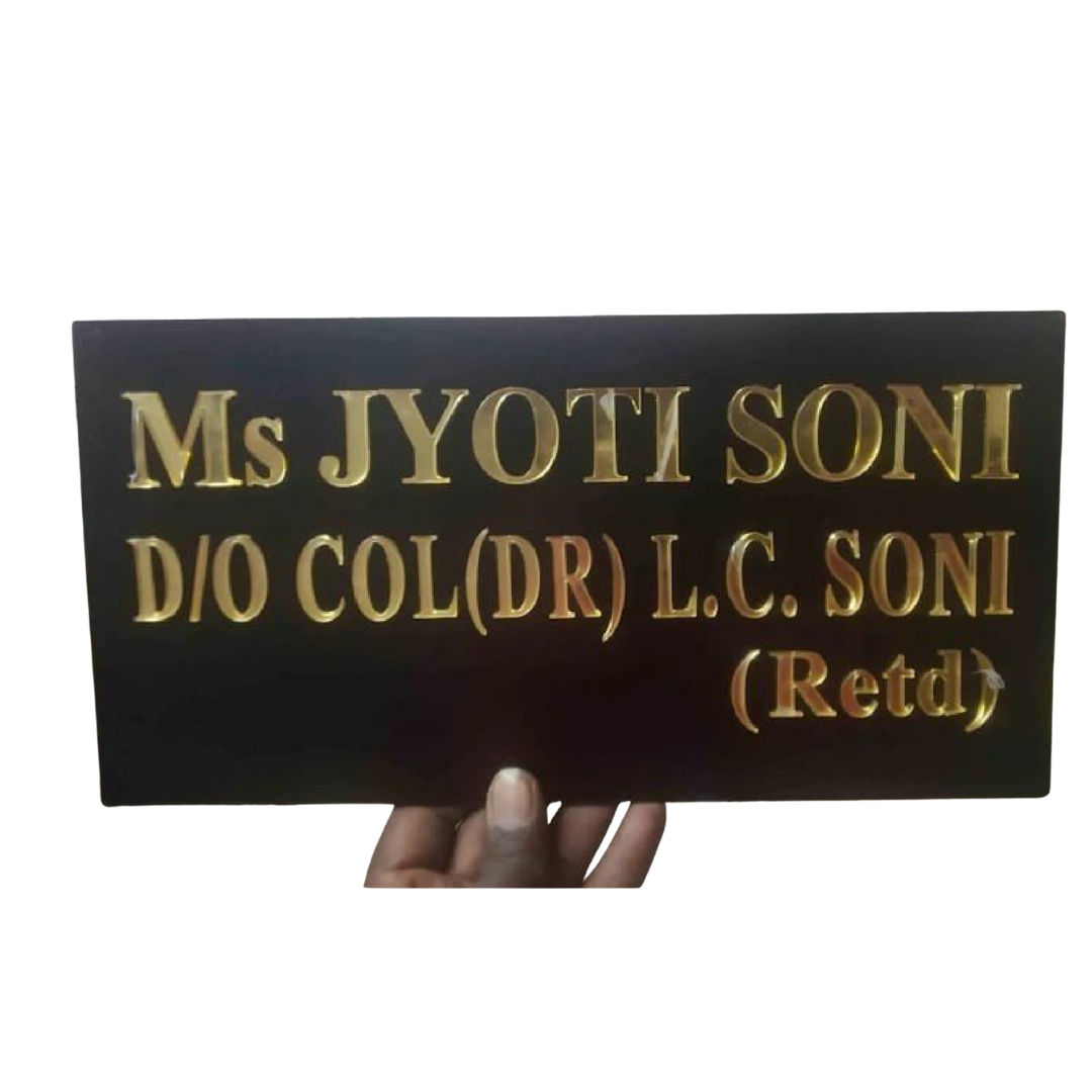 Black rectangular name plate with raised gold lettering reading “Ms Jyoti Soni” and “D/O Col(Dr) L.C. Soni (Retd).”