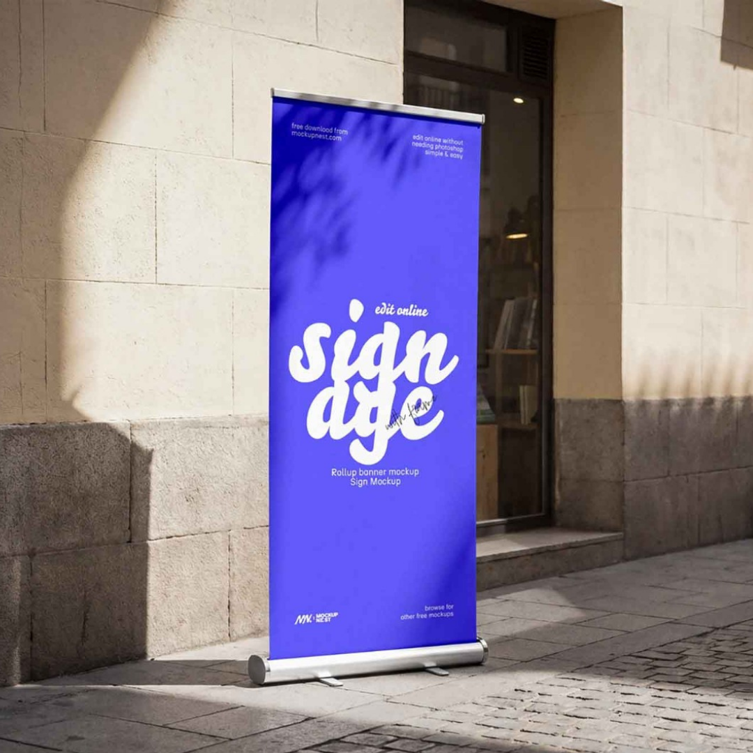 Blue outdoor roll-up banner display stand with custom promotional graphics, manufactured by Elite Writing & Display