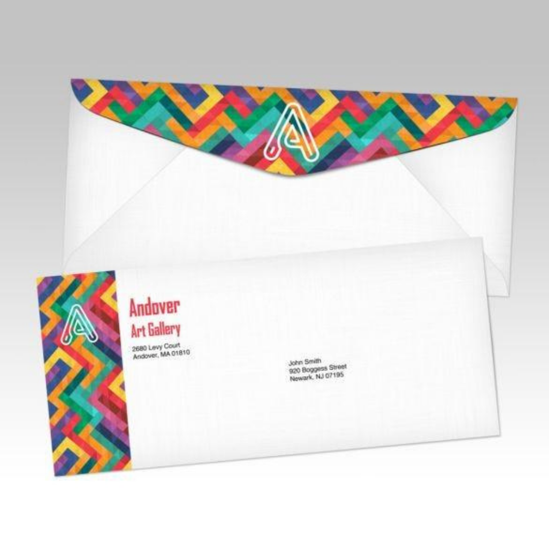 White envelope and letterhead featuring a colorful geometric pattern and gallery branding