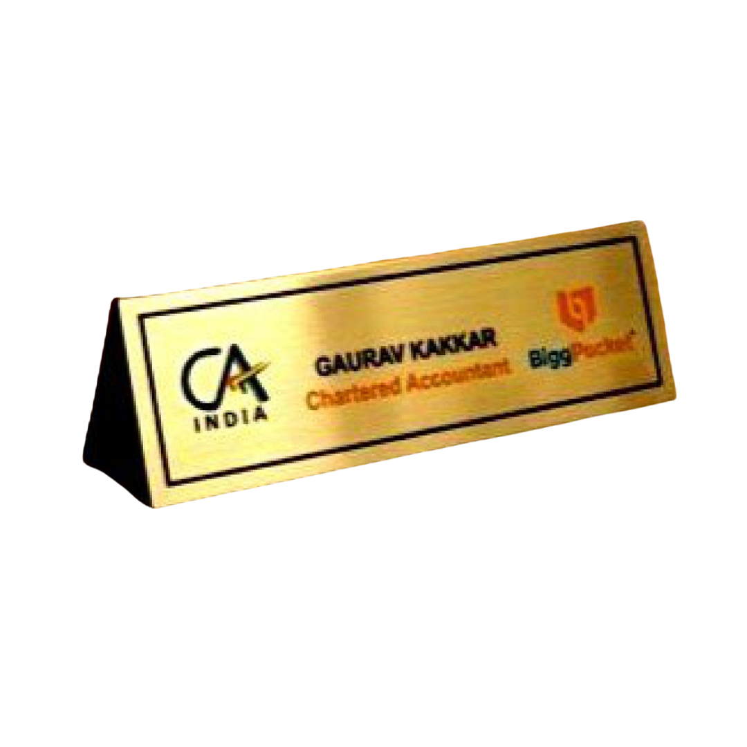 Gold finish tabletop name plate displaying Gaurav Kakkar and Chartered Accountant designation